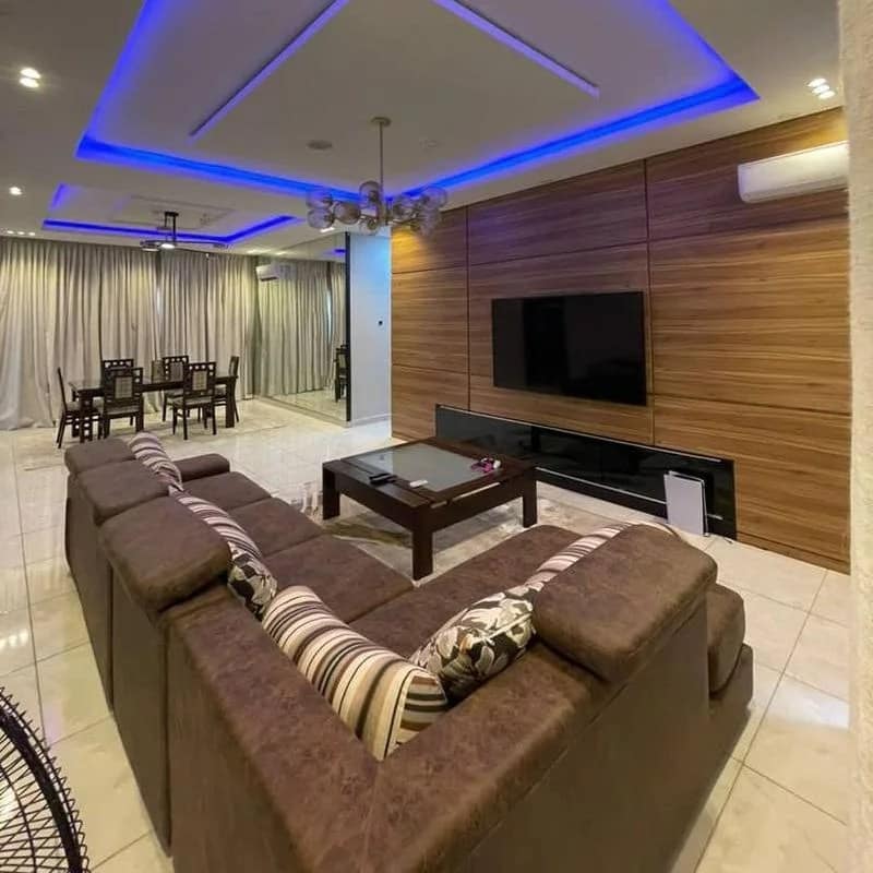 Why choose a short let when in Lagos Living room of 3 bedroom short let behind Nike Art Gallery, along Josemaria Escrivia Street, Lekki.